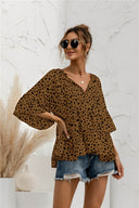 Chic Ruffle Detail Blouse with Modern Polka Dot Design