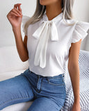 Chic Ruffle Detail Blouse with Bow Accent