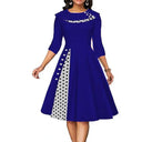 Chic Midi Dress with Dots & Contrast Trim