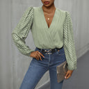 Chic Bodysuit with Statement Sleeves and V-Neck Design
