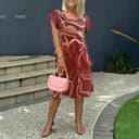 Chic Ruffled Maxi Dress with Intricate Pattern Design