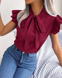 Chic Ruffle Detail Blouse with Bow Accent