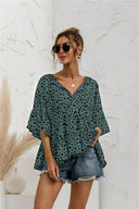 Chic Ruffle Detail Blouse with Modern Polka Dot Design
