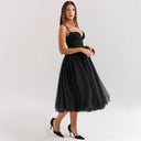 Chic Cocktail Dress with Adjustable Straps and Shimmering Overlay