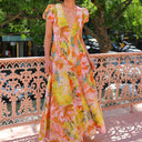 Chic Maxi Dress with Ruffled Sleeves and Deep V-Neck