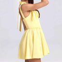 Chic Summer Dress with Cutout Back and Bow Details
