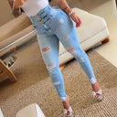 High-Waisted Ripped Skinny Jeans with Button Detail for Women