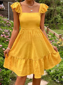 Women’s Cotton Dress with Ruffle Accents and Open Back Design