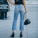 Trendy High-Waisted Jeans with Frayed Accents and Stylish Rips