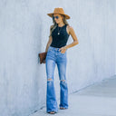 Trendy High-Waisted Flared Jeans with Chic Rips