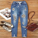 Chic Women's Animal Print Jeans with Distressed Design