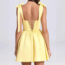 Chic Summer Dress with Cutout Back and Bow Details