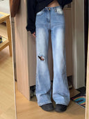 Stylish High-Waisted Flared Jeans with Ripped Accents