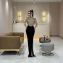 Glamorous Evening Dress with Shimmering Top and Flattering Skirt