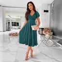 Chic Midi Dress with Wrap Design and Flared Skirt