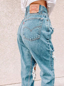 Chic High-Waisted Ripped Jeans with Fringe Accents