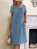 Chic Midi Dress with Pleats and Handy Pockets