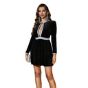 Chic Mini Dress with Deep Neckline & Eye-Catching Accents