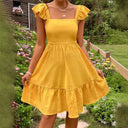 Women’s Cotton Dress with Ruffle Accents and Open Back Design