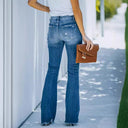 High-Waisted Flared Jeans with Trendy Distressed Design