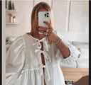 Stylish Checkered Blouse with Unique Cut-Out Design