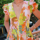 Chic Maxi Dress with Ruffled Sleeves and Deep V-Neck
