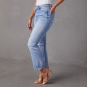 Chic Flared Jeans with Frayed Hems and Trendy Distressed Style