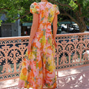 Chic Maxi Dress with Ruffled Sleeves and Deep V-Neck