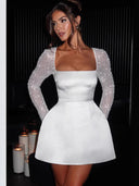 Chic Mini Dress with Sequin Sleeves and Flared Skirt