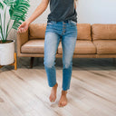 Chic High-Waist Jeans with Button Detail & Fringed Hem