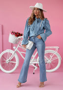 Chic Denim Blouse with Ruffled Accents and Knotted Neckline