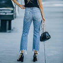 Trendy High-Waist Mom Jeans with Rips and Frayed Hem