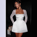Chic Mini Dress with Sequin Sleeves and Flared Skirt