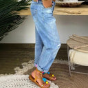 Chic Denim Pleated Trousers with Button Placket and Distressed Detailing