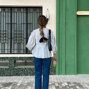 Stylish Checkered Blouse with Unique Cut-Out Design