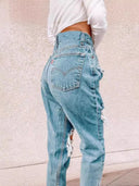Chic High-Waisted Ripped Jeans with Fringe Accents