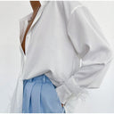Chic Satin Blouse with Feather Accents