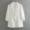 Chic Blazer Jacket with Structured Sleeves and Gold Accents