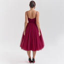 Chic Cocktail Dress with Adjustable Straps and Shimmering Overlay