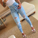 High-Waisted Ripped Skinny Jeans with Button Accent for Women