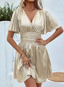 Shimmering V-Neck Mini Dress with Voluminous Sleeves