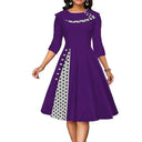 Chic Midi Dress with Dots & Contrast Trim