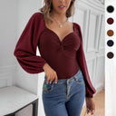 Chic Women's Bodysuit with Knot Accents and Puff Sleeves