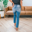 Chic Women's High-Waist Jeans with Unique Button and Fringed Hem Design
