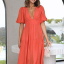 Chic Maxi Dress with Deep V-Neck and Flowy Skirt