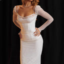 Chic Maxi Dress with Sheer Sleeves and Ruffled Hem