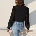 Chic Bodysuit with Statement Sleeves and V-Neck Design