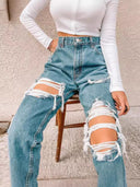 Chic High-Waisted Ripped Jeans with Frayed Accents