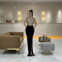 Glamorous Evening Dress with Shimmering Top and Flattering Skirt