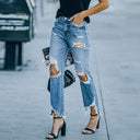 Trendy High-Waisted Jeans with Frayed Accents and Stylish Rips